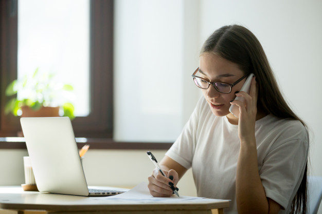 Home services agent consulting with client over phone